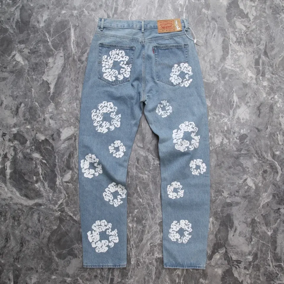 Levi's 501 denim jeans blue cotton with white abstract floral print design on legs and pockets