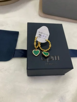 Apm Monaco Peacock Stone Love Circle Earrings displayed in a gift box with a price tag, featuring green stones and gold accents, ideal for jewelry enthusiasts and gift shoppers.