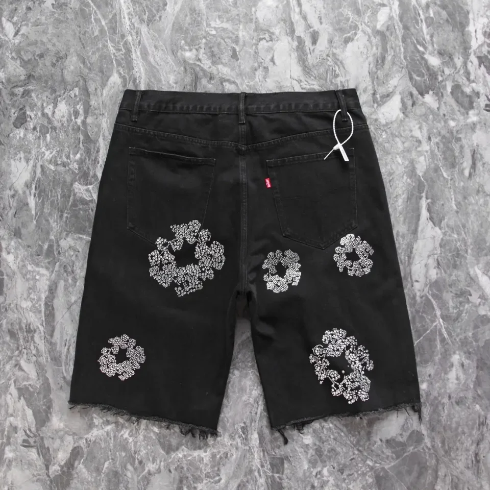 Levi's shorts black denim with white floral sequin embroidery and raw hem detailing