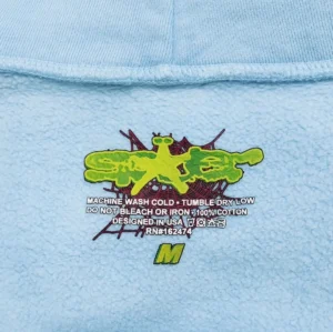 Supreme hoodie medium blue 100% cotton with graphic print and care instructions inside collar