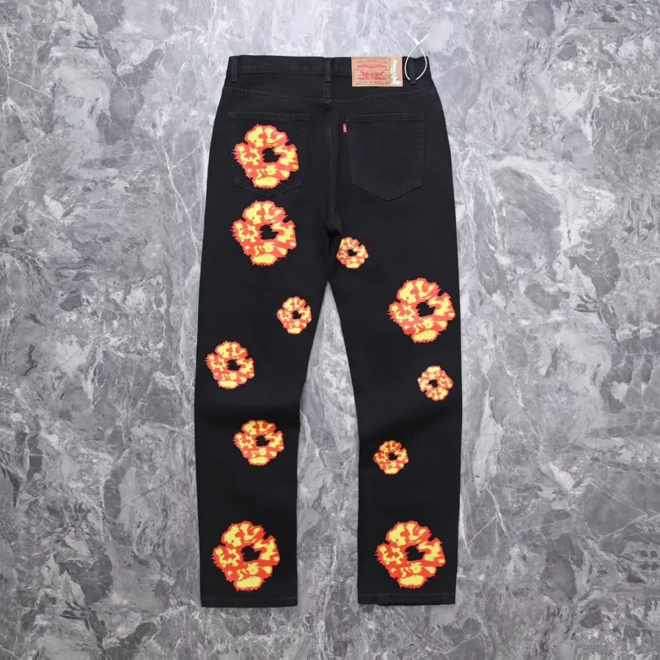 Levi's 501 regular fit jeans black denim with orange and yellow floral print patches