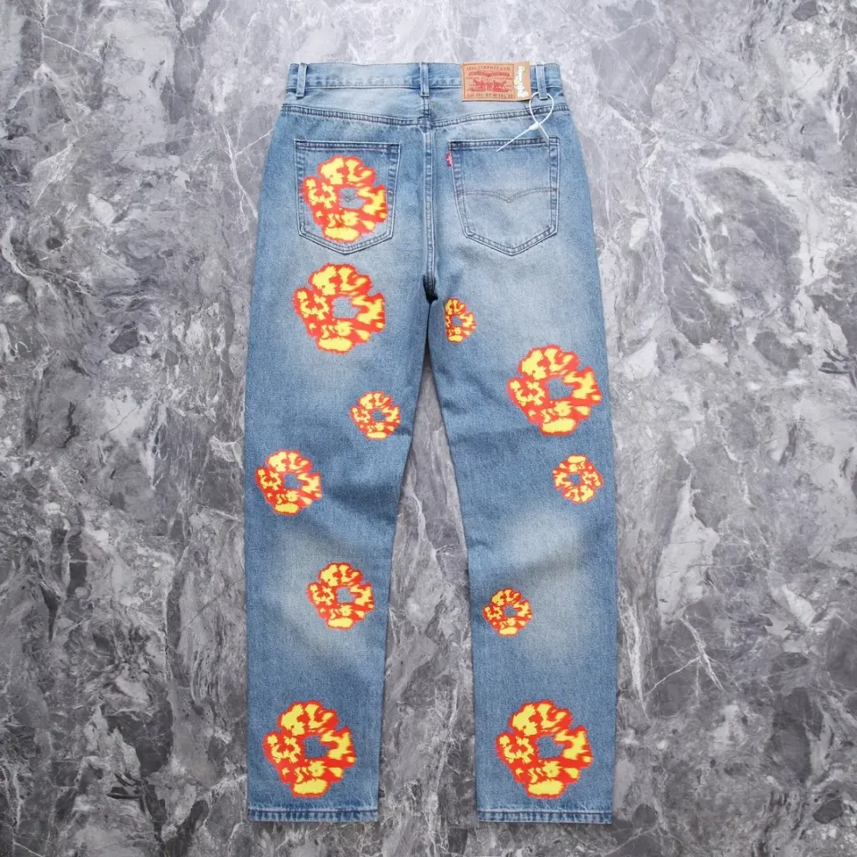 Levi's 501 blue denim jeans with orange and yellow floral embroidery cotton material