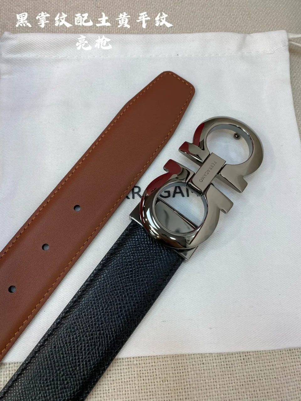 Salvatore Ferragamo belt black textured leather front strap brown leather back strap silver double Gancio buckle