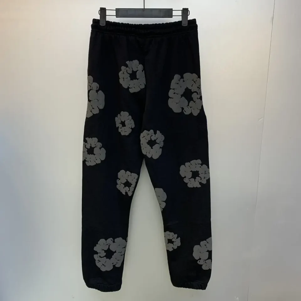 No brand visible black sweatpants with gray floral pattern cotton fabric relaxed fit