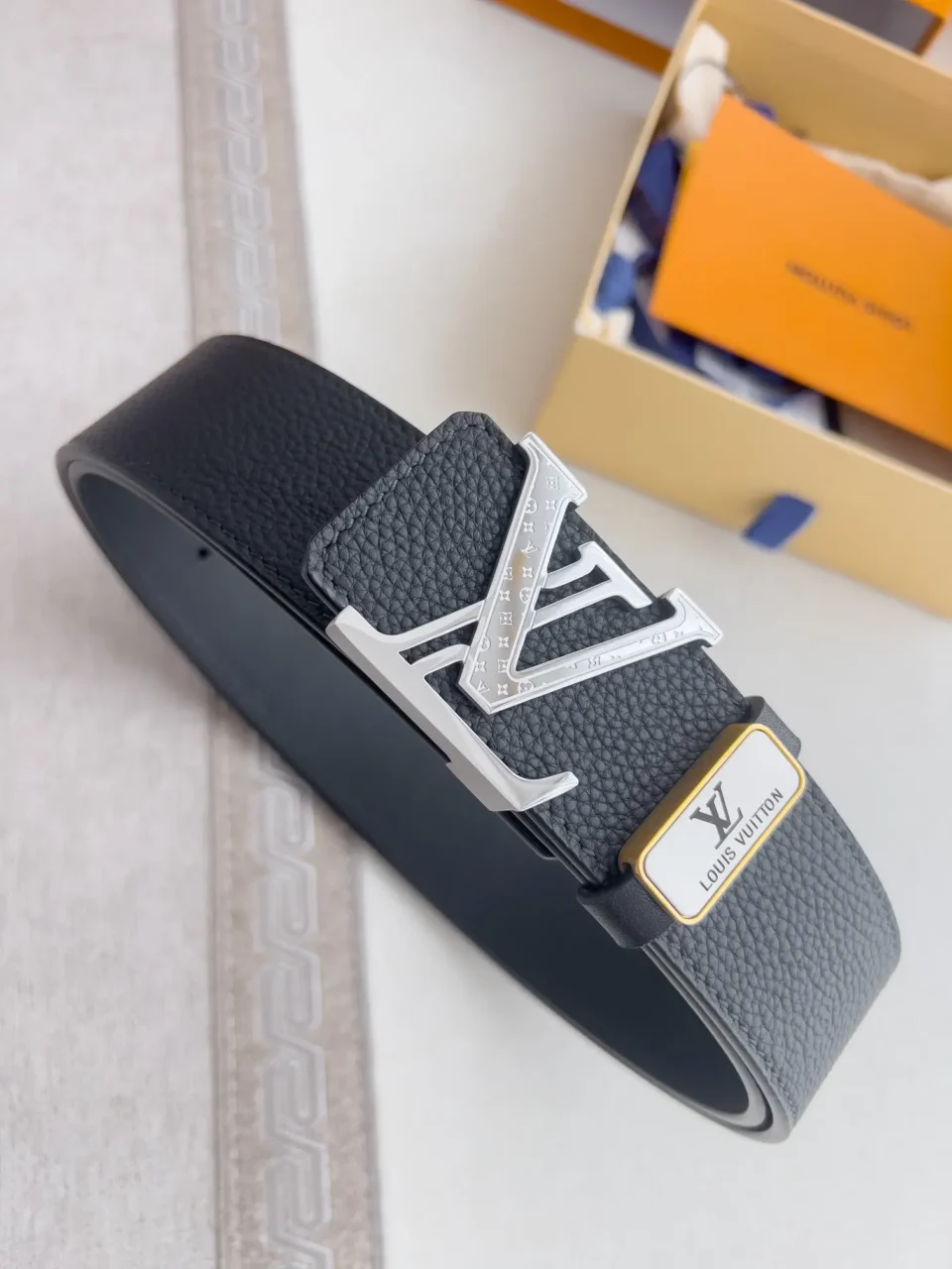 Louis Vuitton belt black textured leather silver LV buckle gold white logo accessory