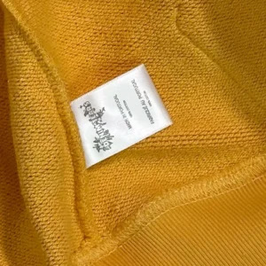 Vetements sweatshirt mustard yellow cotton fabric close-up with brand label sewn inside neckline