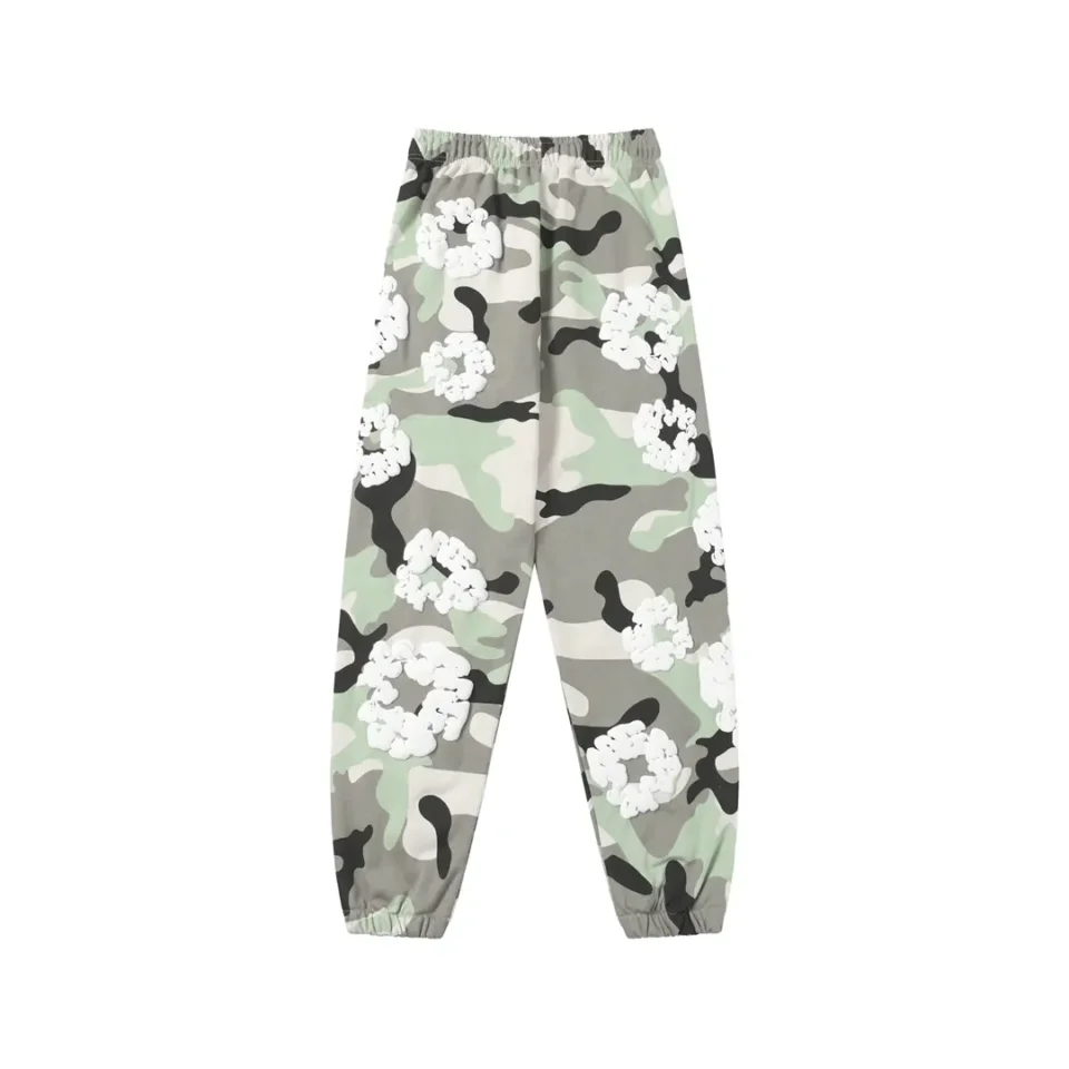 No brand provided, camo print jogger pants with white floral accents, elastic waistband and cuffs, cotton material
