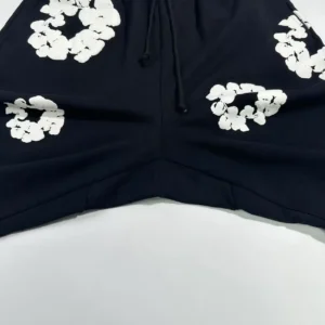 Unknown brand shorts black cotton fabric with white floral print and drawstring waistband