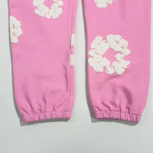 No brand visible pink sweatpants with white floral pattern cotton fabric elastic cuffs