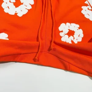 Nike hoodie orange cotton pullover with white floral print and drawstring hood