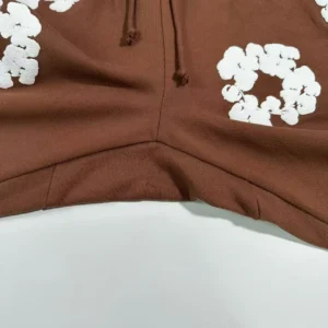 Carhartt WIP hoodie brown cotton fleece fabric with white floral print detail and drawstring hood