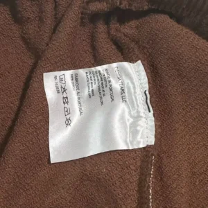 Resthim Tears LLC garment brown fabric 100% cotton made in Portugal care label