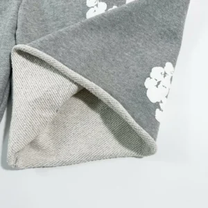 Grey cotton shorts featuring floral design and textured hem, part of Denim Tears Main Line Hemp collection.