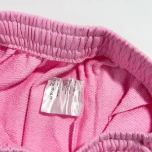 Denim Tears terry cloth shorts pink cotton elastic waistband made in Portugal label close-up