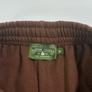 Denim Tears sweatpants medium brown terry cloth fabric with elastic waistband and branded green label