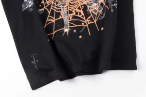 Cactus Jack long sleeve t-shirt black cotton with orange spider web graphic and grey logo print on sleeve