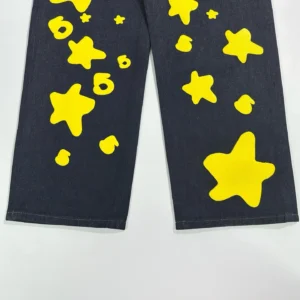 Sp5der Beluga Star Original Color Jeans featuring bold yellow star patterns on dark denim, highlighting unique design elements for casual wear.