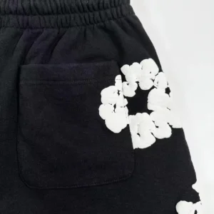 Repsgoat black shorts with white floral graphic cotton blend fabric and elastic waistband detail