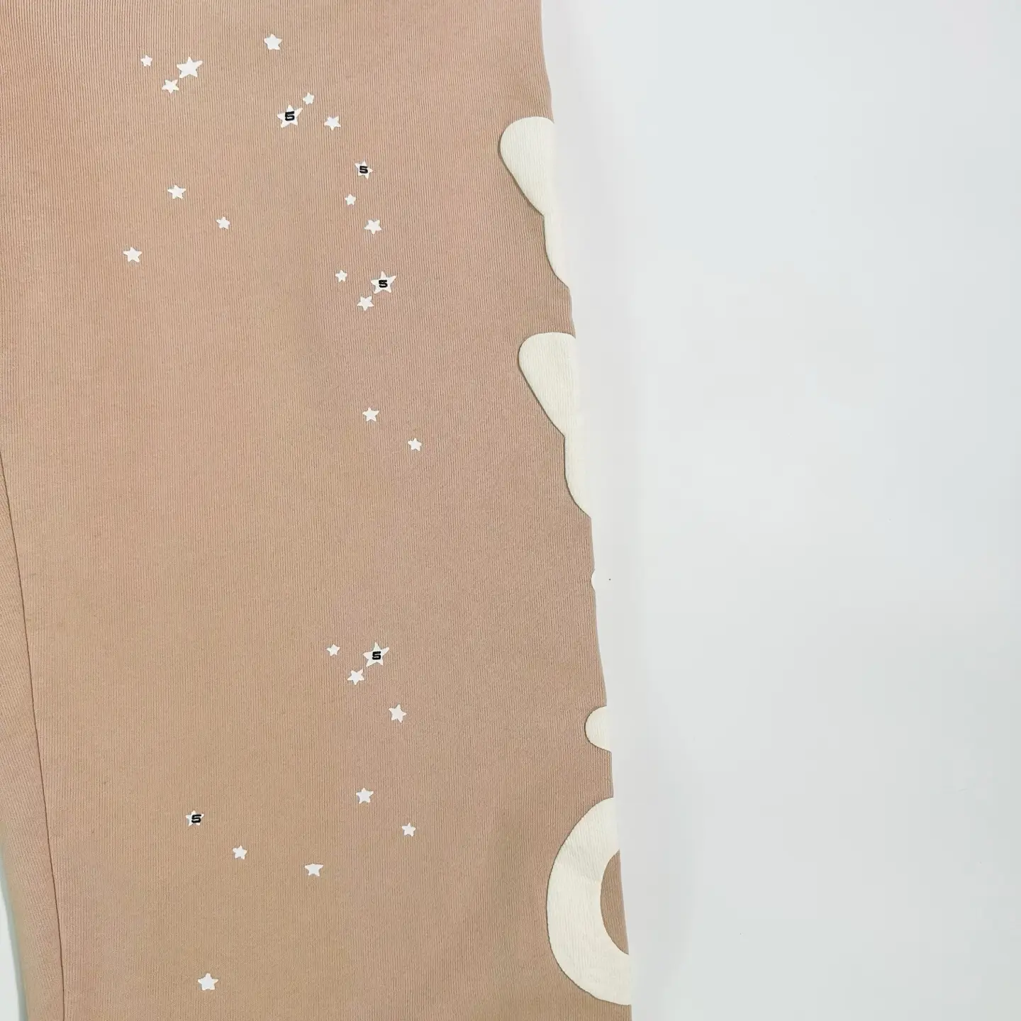Sder Camel Beluga Sweatpants 05 featuring star pattern and logo detail, showcasing fabric quality and design elements for e-commerce presentation.