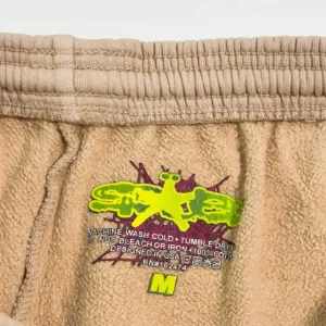 Sder Camel Beluga Sweatpants 05 fabric label showing care instructions and SP5DER logo.