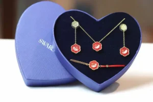 Swarovski jewelry set gold-tone metal red enamel swan pendant earrings and bracelet in heart-shaped box