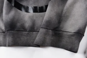 Close-up of Hellstar Studios G hoodie showcasing fabric texture and detailing.