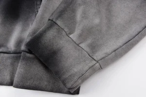 Close-up of Hellstar Studios G hoodie sleeve and cuff detail, showcasing premium fabric and craftsmanship.