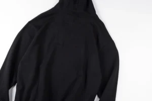No brand visible black hoodie sweatshirt cotton material with hood and long sleeves