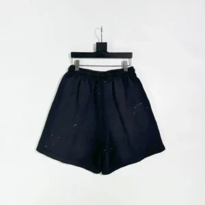 Hellstar Black Halloween shorts displayed on a hanger, featuring a dark fabric design suitable for Halloween-themed fashion.