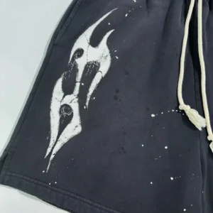 Hellstar Black Halloween shorts featuring a distinctive white graphic design and drawstring detail, showcasing a blend of style and comfort for fashion enthusiasts.