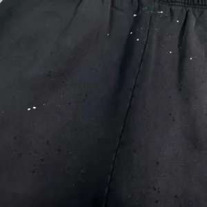 Hellstar Black Halloween shorts in black fabric featuring white splatter design, highlighting unique style for Halloween fashion.