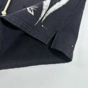 Black Halloween shorts featuring unique graphic design and drawstring detail, showcasing craftsmanship for Hellstar e-commerce platform.