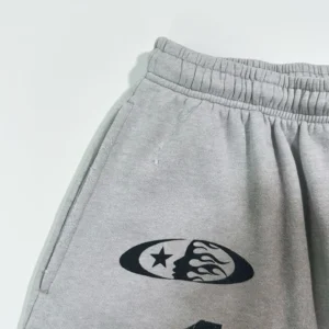 Chinatown Market Distorted Smile Sweatpants CTM015 gray cotton blend with black graphic print and elastic waistband