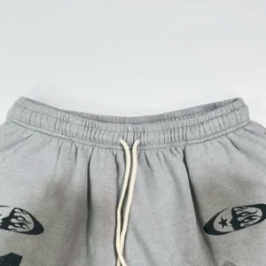 Unknown brand sweatpants gray color with white drawstring and black graphic prints cotton blend material