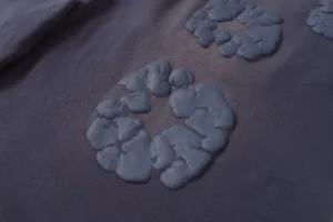 RepsGoat hoodie black cotton fabric raised logo patch detail close-up