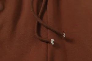 Repsgoat brown hoodie drawstring cotton fabric close-up texture and stitching detail