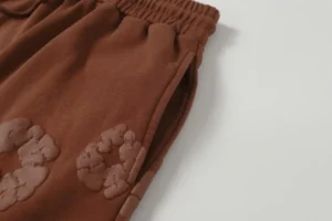 Repsgoat brown sweatpants with embossed logo cotton material elastic waistband pocket design