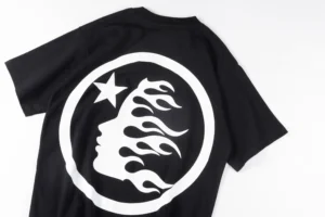 Black T-shirt featuring a large white NS logo with a stylized face and flames, representing Hellstar Studios clothing line.