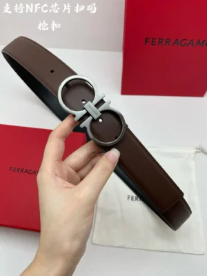 Ferragamo belt brown leather double G metal buckle with black lining and Ferragamo packaging background