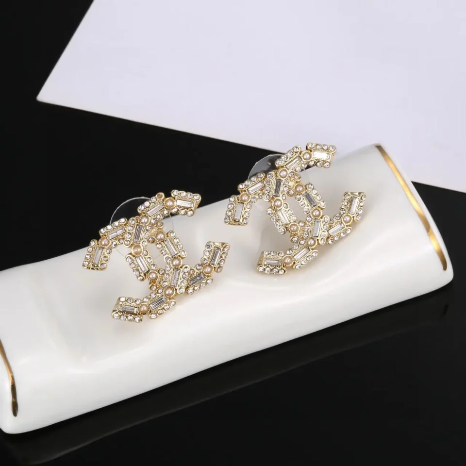 Chanel earrings gold tone metal with crystal and pearl embellishments luxury accessories
