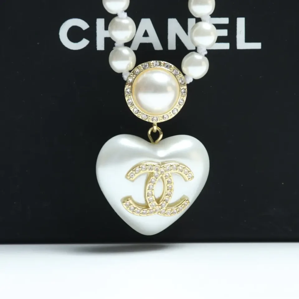 Chanel necklace white pearl heart pendant gold tone metal with rhinestone CC logo accessory