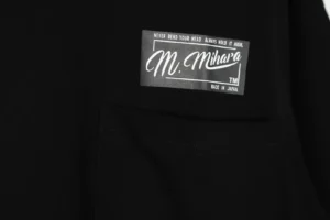 Mihara black cotton t-shirt with white logo patch and pocket made in Japan