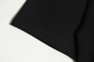 RepsGoat black cotton t-shirt close-up showing fabric texture and stitching detail