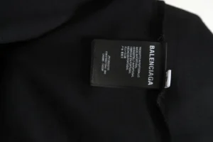 Balenciaga clothing label black fabric tag sewn inside garment indicating made in Portugal
