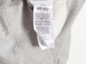 Kenzo clothing tag made in Portugal cotton material with care instructions in multiple languages