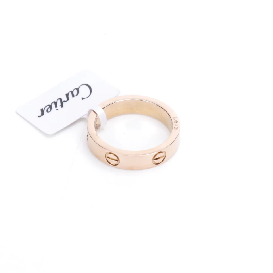 Cartier Love ring rose gold band with screw motif unisex jewelry accessory