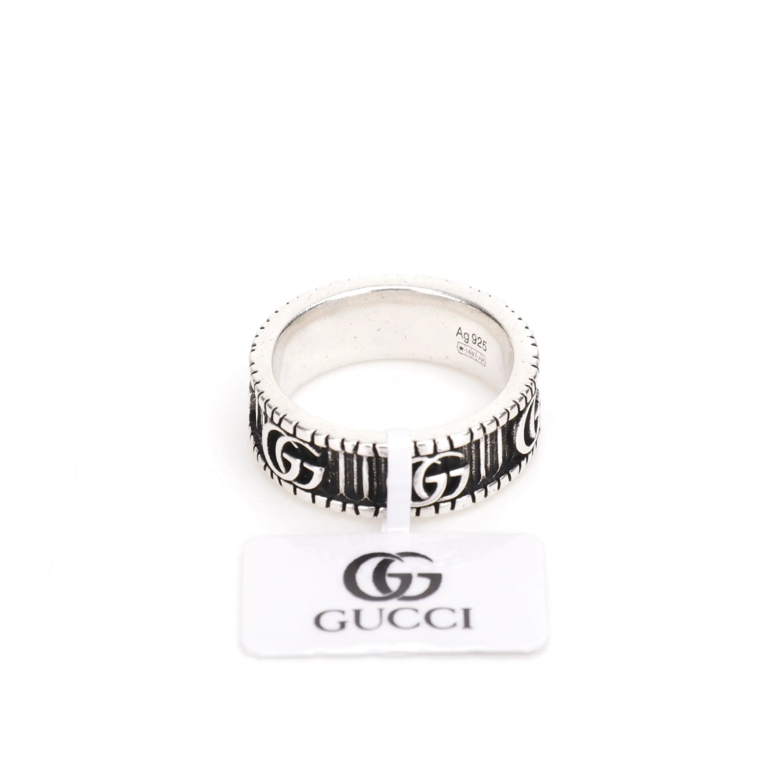 Gucci Double G silver ring featuring a bold design, engraved logo, and a tag displaying the brand name, showcasing affordable luxury.