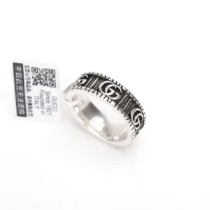 Gucci Double G silver ring with black detailing and tag, featured as an affordable luxury item for purchase.
