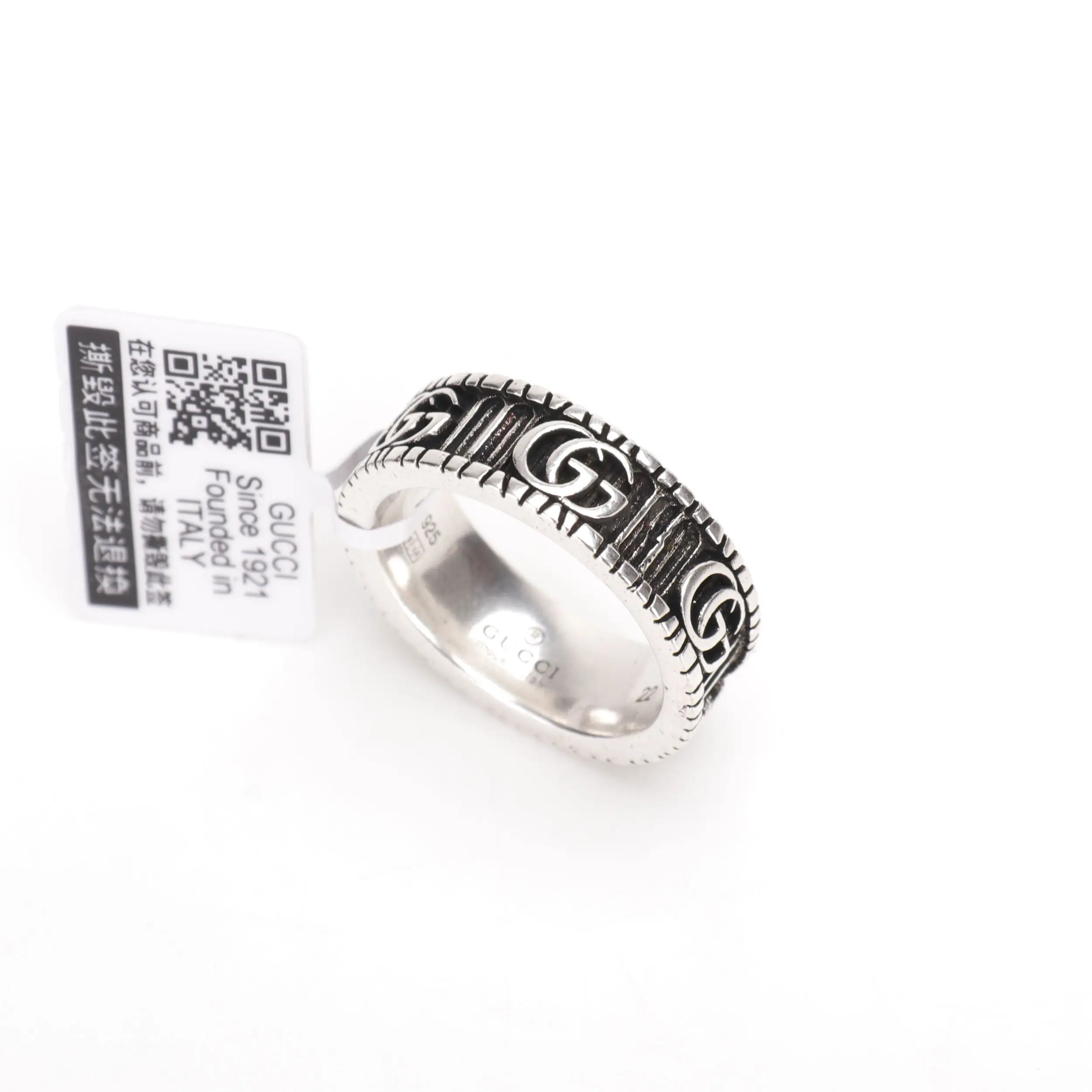 Gucci Double G silver ring with intricate logo design, featuring a price tag indicating affordable luxury.