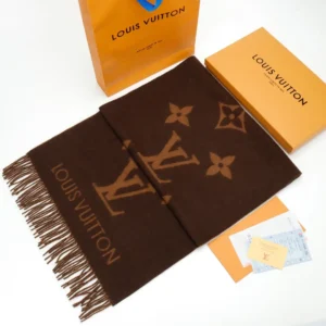 Louis Vuitton Printed Cashmere Fringe Scarf displayed with packaging, showcasing luxury design and quality craftsmanship.